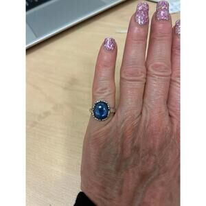 sterling silver ring featuring a kyanite blue cabochon stone